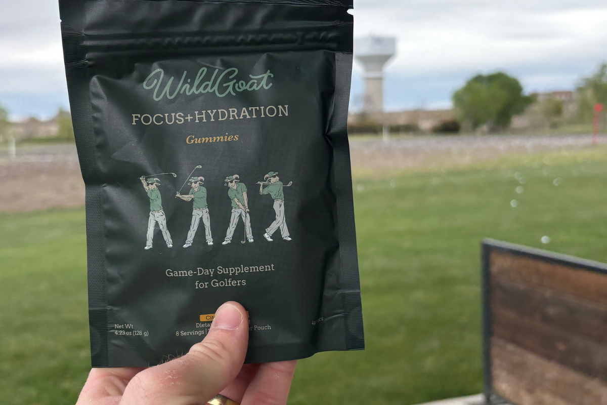 Four WildGoat gummies in a golf glove