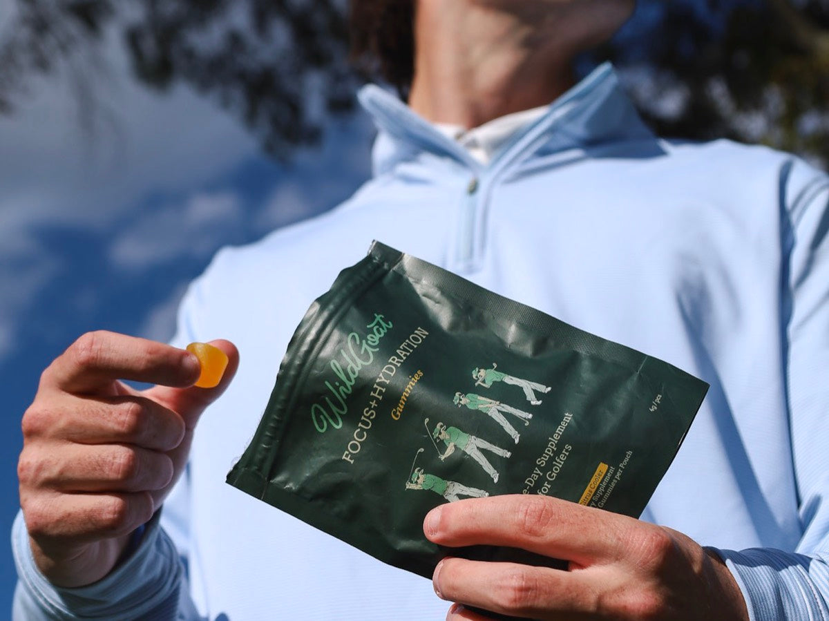 Four WildGoat gummies in a golf glove